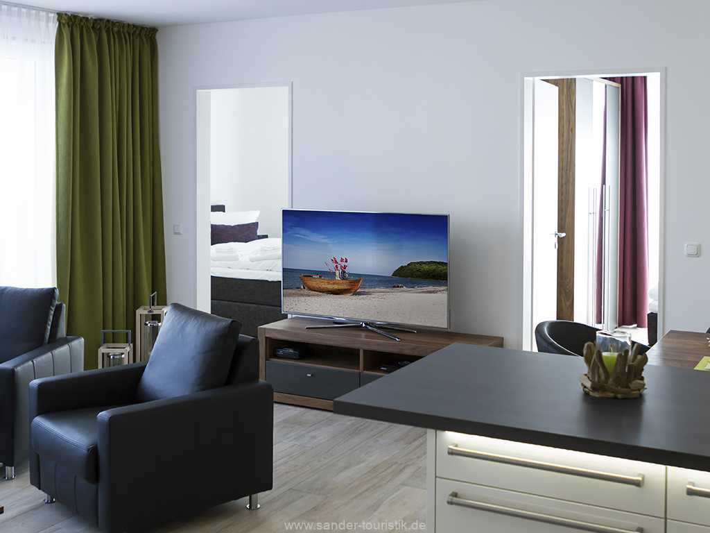 Wohnzimmer mit Blick auf die Zugänge zu den Schlafzimmern Wohnzimmer mit Blick auf die Zugänge zu den Schlafzimmern